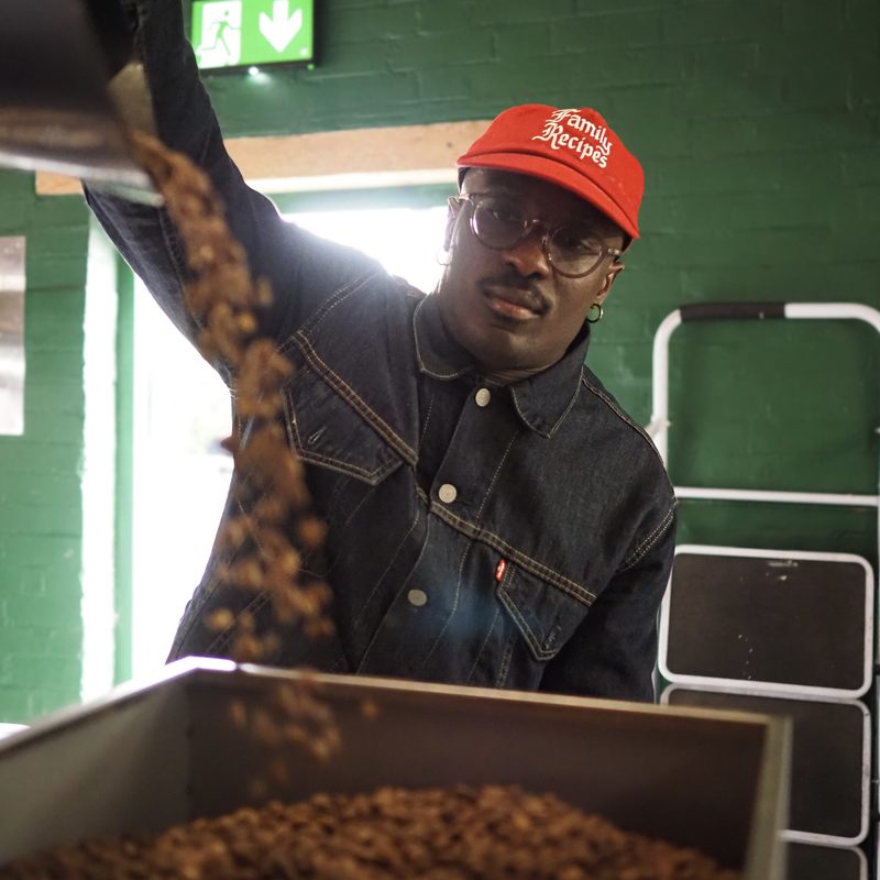 Freshly roasted beans pouring into a box